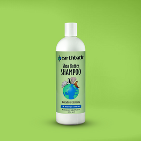 A bottle of earthbath Shea Butter Shampoo for pets, with a label on green background