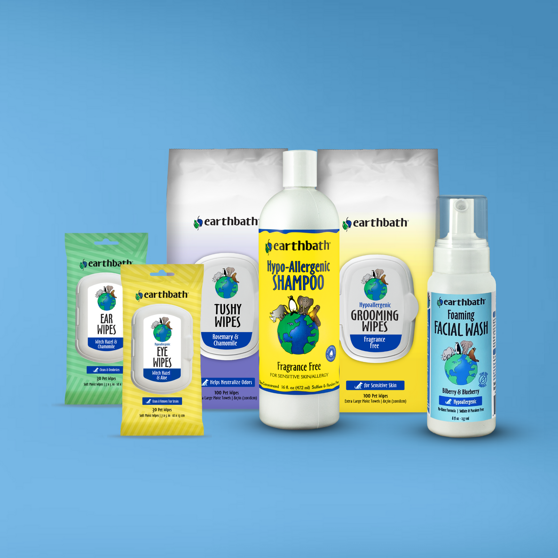 A set of earthbath branded pet grooming products for dogs on blue background